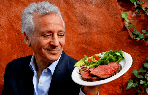 Pierre Dukan holds a plate of protein products